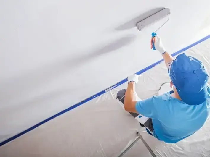 interior painting crew finishing office walls near Canyon Park in Bothell with clean work area